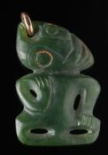 A Maori carved nephrite Hei Teki: of traditional design 5.25cm. high.