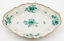 A Chelsea-Derby fluted oval dish: painted in green monochrome with floral swags, gilt dentil rim,