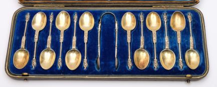 A set of twelve Victorian silver apostle teaspoons and tongs, maker William Gibson & John Langham,