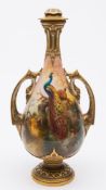A Royal Worcester porcelain lamp: of slender two handled pedestal form with raised strap work to