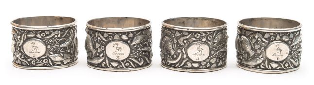 Four Chinese silver napkin rings, maker Wang Hing & Co, Hong Kong: decorated with sea fish,