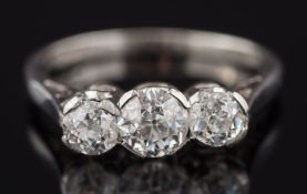 A diamond three stone ring: with graduated, old-cut diamonds approximately 0.30ct, 0.65ct and 0.
