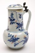 A Chinese 'Imari' porcelain chocolate pot and cover: of baluster form with side spout and metal