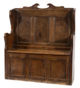 An 18th Century and later oak box settle:, of small size,