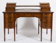 By Edwards & Roberts An Edwardian mahogany and marquetry writing desk:,