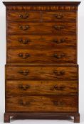 A George III mahogany chest on chest:, the upper part with a moulded dentil cornice,