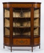 An Edwardian mahogany, satinwood, inlaid and decorated display cabinet:, of D shaped outline,