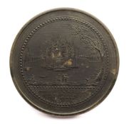 A late 18th Century French tortoiseshell snuff box: the circular top decorated with a view of
