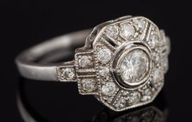 A diamond mounted rectangular cluster ring: with central circular diamond approximately 0.