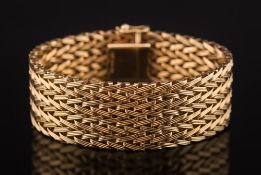 A 9ct gold mesh-link bracelet:, 20mm wide, approximately 17.8cm total length, 40gms gross weight.
