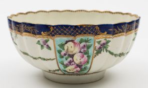 A Worcester fluted slop bowl: painted with alternate panels of spotted fruit on a turquoise ground