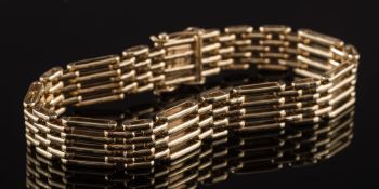 A 9ct gold four-bar gate-link bracelet:, approximately 22cm total length, 44gms gross weight.