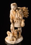 A Japanese carved ivory okimono of a woodsman: Meiji period (1864-1912),