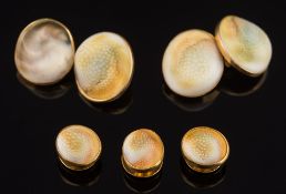 A pair of 18ct gold and operculum mounted cuff-links: (one shell replaced) and three matching studs
