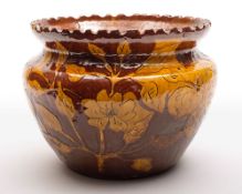 A Bideford East-the-Water pottery jardiniere: of squat circular form with flared and notched rim,