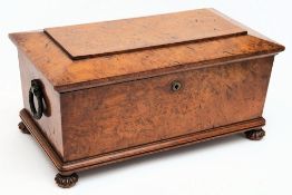A Victorian burr walnut tea caddy: of sarcophagus outline,