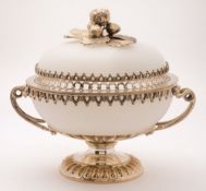 An opaque white glass circular pedestal bowl and cover with plated mounts: of circular form,