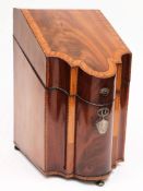 A Georgian mahogany satinwood crossbanded and chequer strung cutlery box: of serpentine outline,