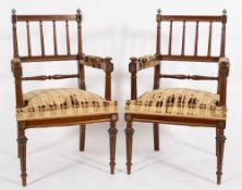 A pair of French mahogany and brass mounted open armchairs:,