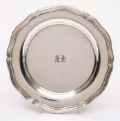 A Continental silver plated dish, marks worn: crested, of circular form with moulded reeded border,