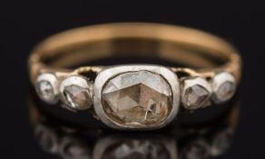 A gold and rose diamond five stone ring: the principal stone approximately 7mm long x 5.