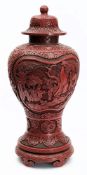 A large Chinese cinnabar lacquer vase and cover: of ovoid form,
