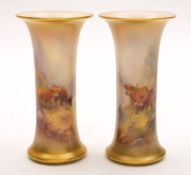 A pair of Royal Worcester vases painted by Harry Stinton: of trumpet form,