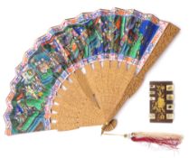 A 19th century Cantonese carved sandalwood fan: the paper leaf decorated with figures in a garden