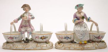 A pair of French porcelain flower seller groups: in the Meissen manner,