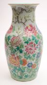 A Chinese porcelain vase: of baluster form enamelled in the famille rose palette with peony,