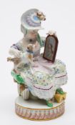 A Meissen porcelain figure of a seated lady and dog: modelled after the original by Michael Victor