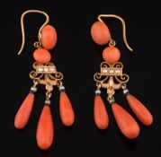 A pair of gold, coral and seed pearl drop earrings: each suspending three graduated coral drops,