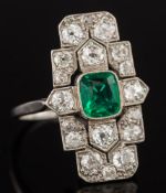 An Art Deco emerald and diamond rectangular plaque ring: with central cushion-shaped emerald