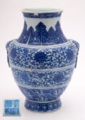 A Chinese blue and white vase, Hu: with mythical beast mask and ring handles,