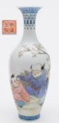 A Chinese eggshell porcelain vase: of slender oviform with raised flaring neck enamelled in colours