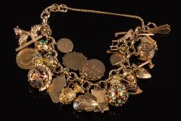 A 9ct gold circular-link bracelet: with twenty five various attached charms including a mounted