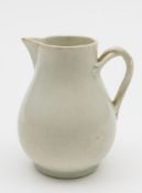 A Worcester sparrow-beak milk jug: in the white, of baluster form with entwined branch handle,