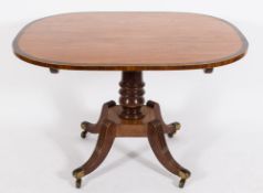 A Regency satinwood, rosewood crossbanded and inlaid breakfast table:, of elliptical outline,