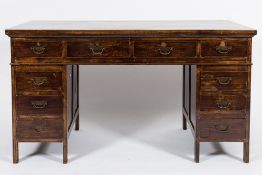 A Chinese rectangular pedestal desk:, fitted with four frieze drawers and six pedestal drawers,