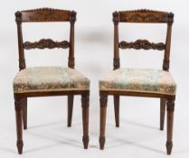 A set of four Regency Colonial carved rosewood dining chairs:,