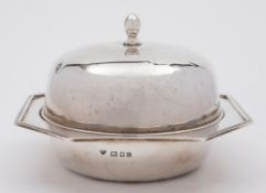 A George V silver muffin dish, cover and liner, maker Goldsmiths & Silversmiths Co Ltd, London,