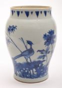 A Chinese blue and white porcelain jar: of ovoid form with short concave neck, painted with birds,
