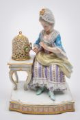 A Meissen porcelain figure: allegorical of the sense of feeling and modelled after the original by