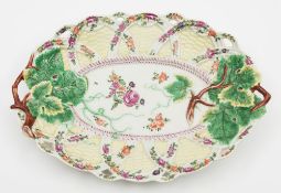 A Worcester yellow-ground oval basket pattern dish: with pierced rim, moulded with vine leaves,
