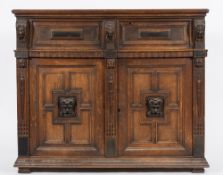 A 17th Century oak side cupboard:, with a moulded top,