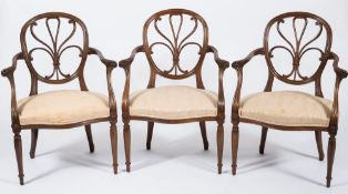 A set of three American walnut open armchairs in the Hepplewhite taste:,
