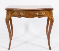 A Victorian walnut, inlaid and gilt metal mounted side table:, of serpentine outline,
