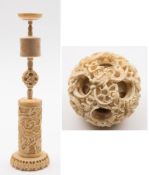 A Canton carved ivory concentric puzzle ball on stand: of conventional form carved and pierced with