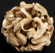 A Japanese carved ivory okimono,