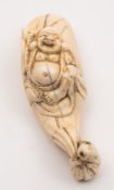 A Japanese carved ivory netsuke,